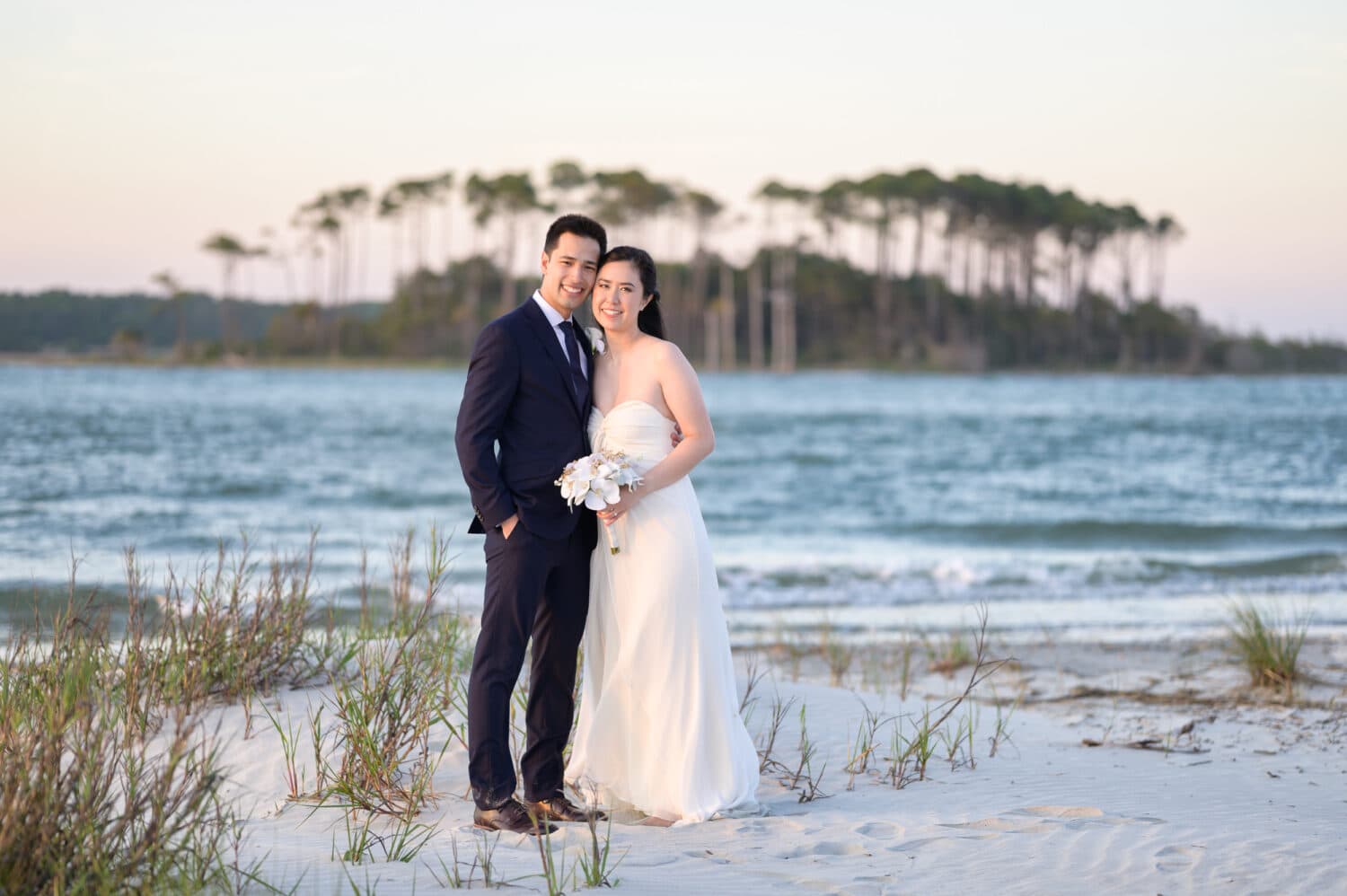 Just married couple at sunset with an island in the background - Cherry Grove Point - North Myrtle Beach