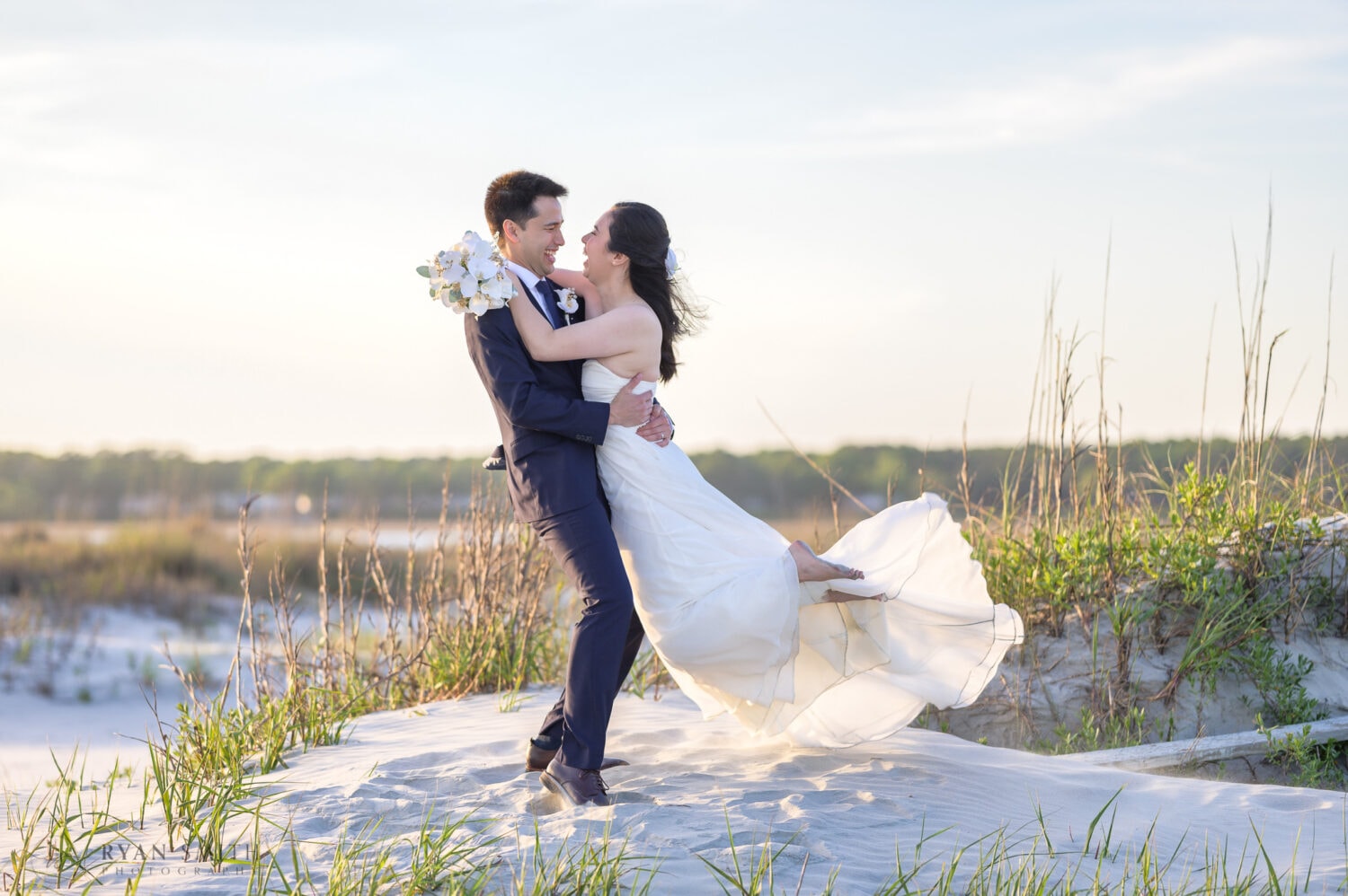 Lifting bride into the air on the dunes - Cherry Grove Point - North Myrtle Beach