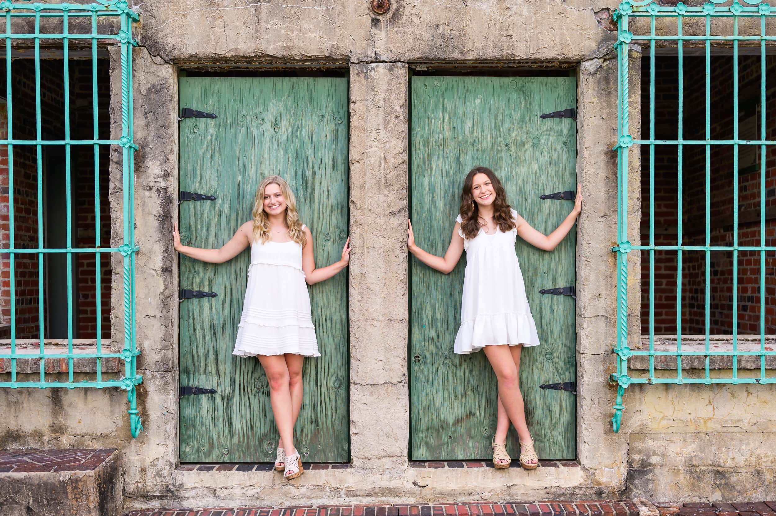 Sisters standing in the castle doors - Huntington Beach State Park