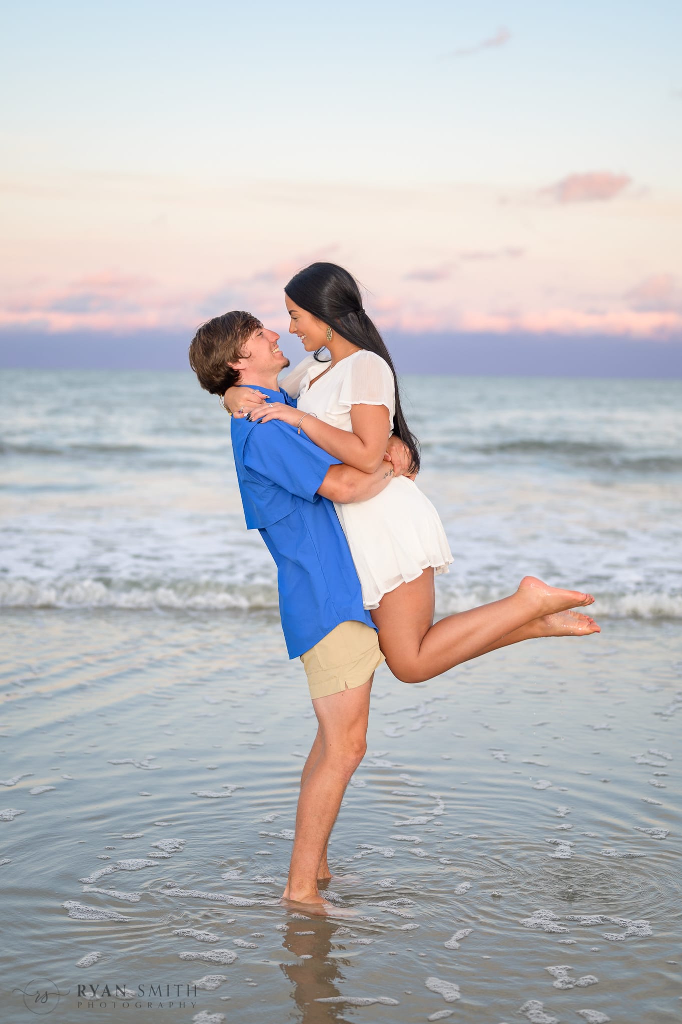 Lifting girlfriend into the air - Huntington Beach State Park