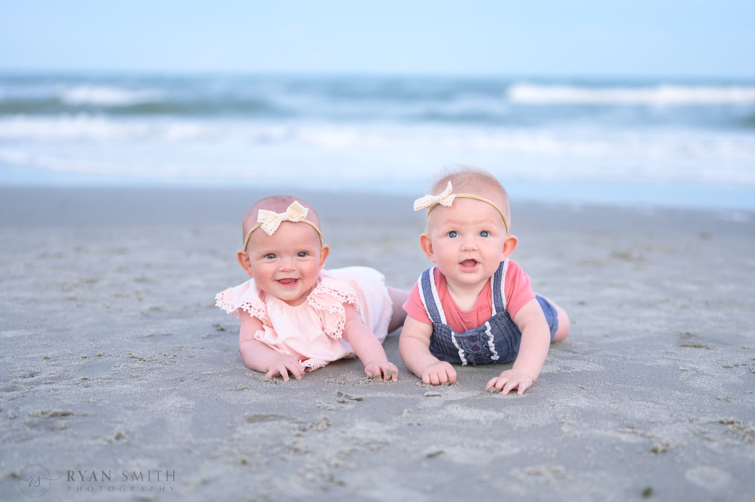Baby cousins laying by the ocean - Huntington Beach State Park