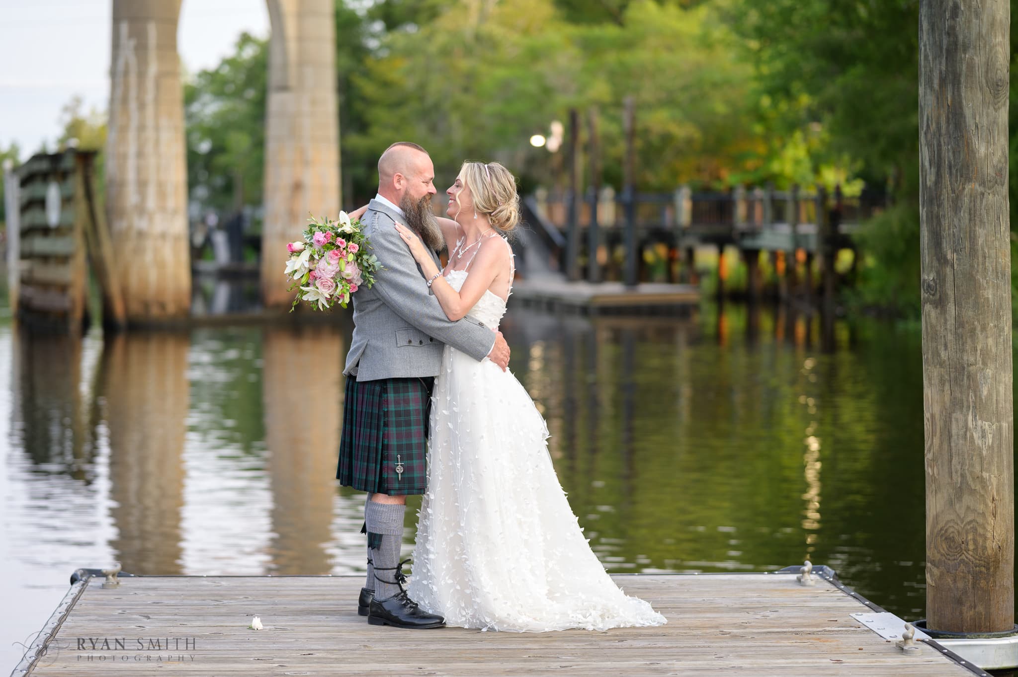 Embracing on the docks by the river - Conway Riverwalk