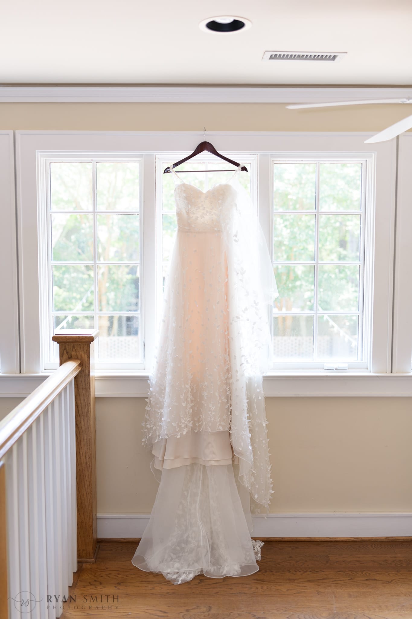 Wedding dress hanging in the window - Brookgreen Gardens