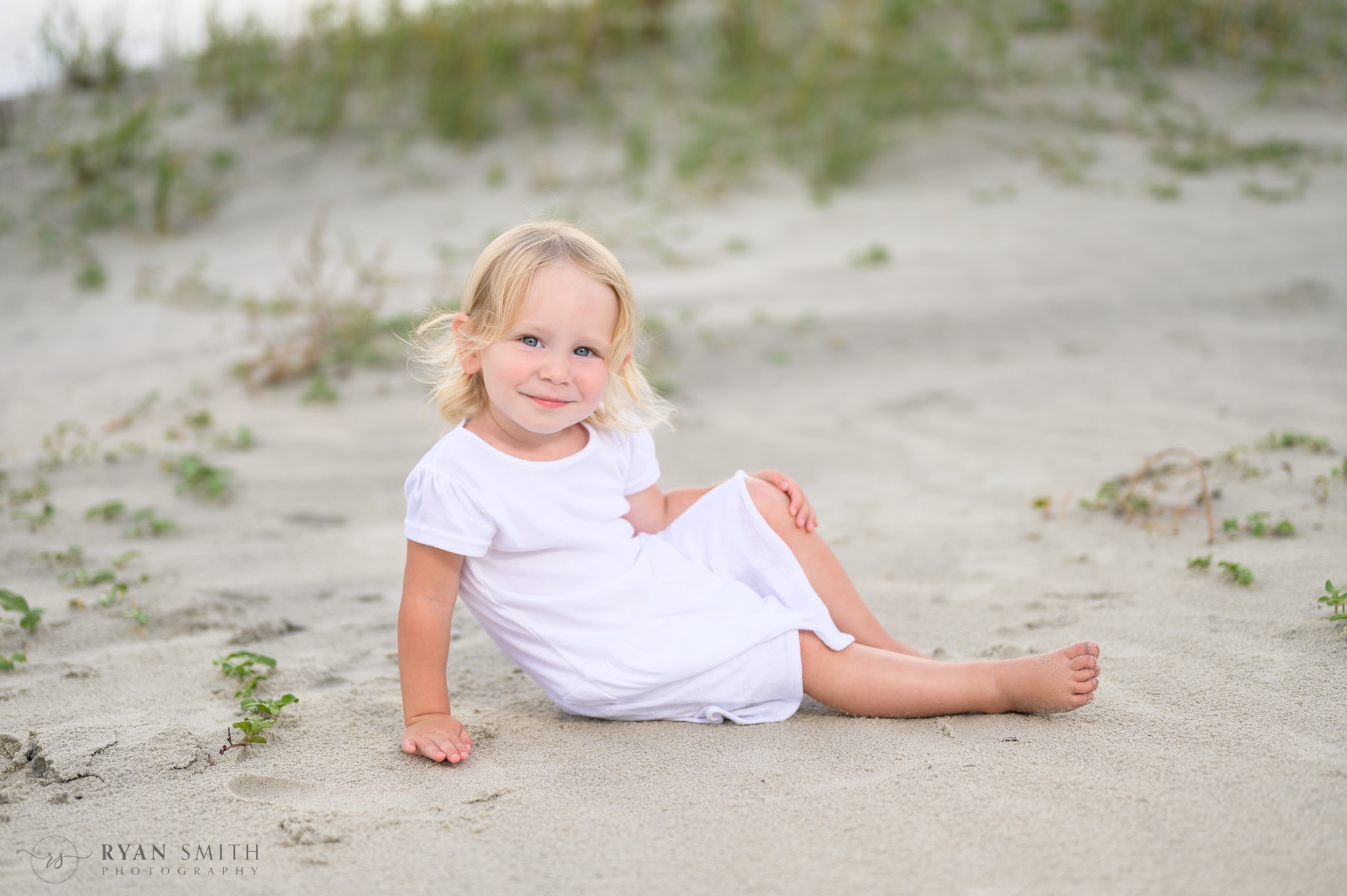 Baby girl laying by the dunes - Huntington Beach State Park