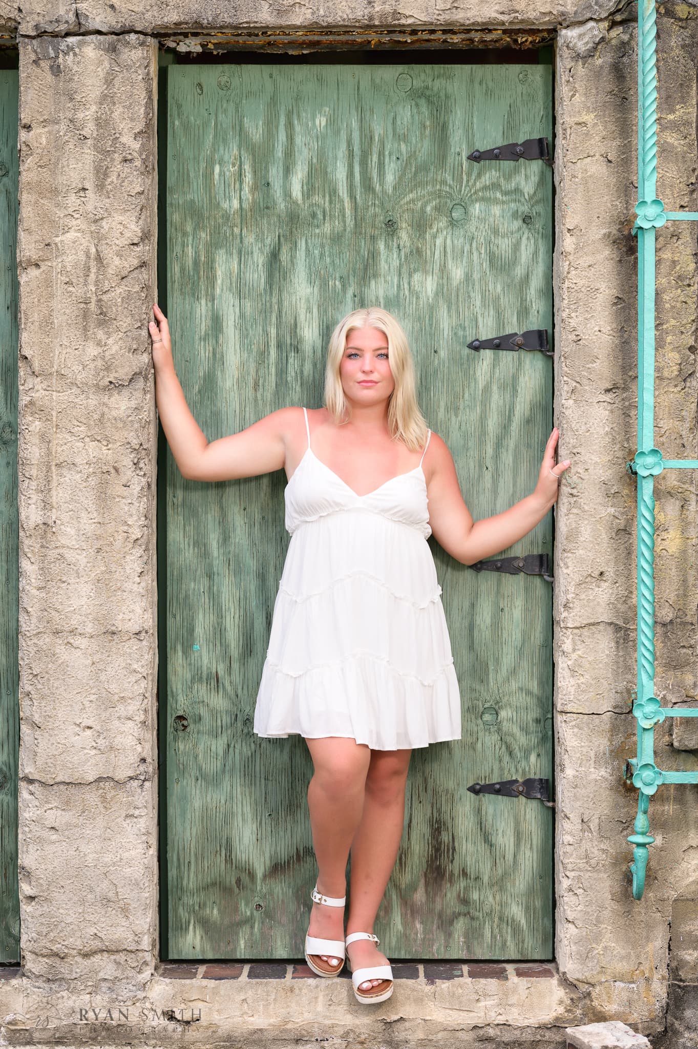 Girl senior portrait standing in the doorway of the castle - Huntington Beach State Park