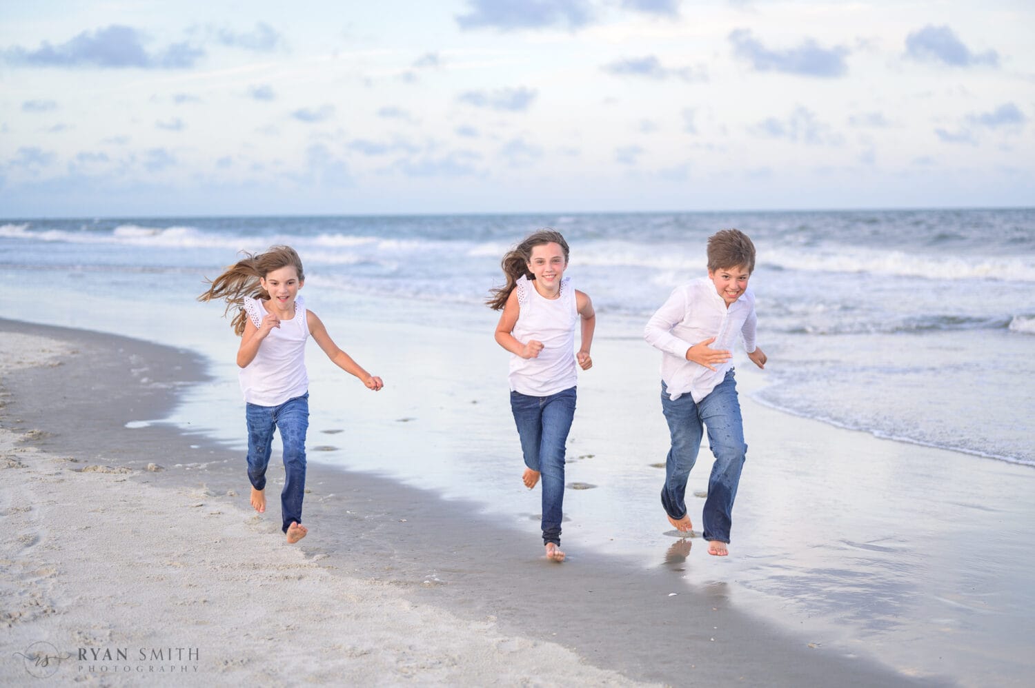 Kids running down the beach - Huntington Beach State Park