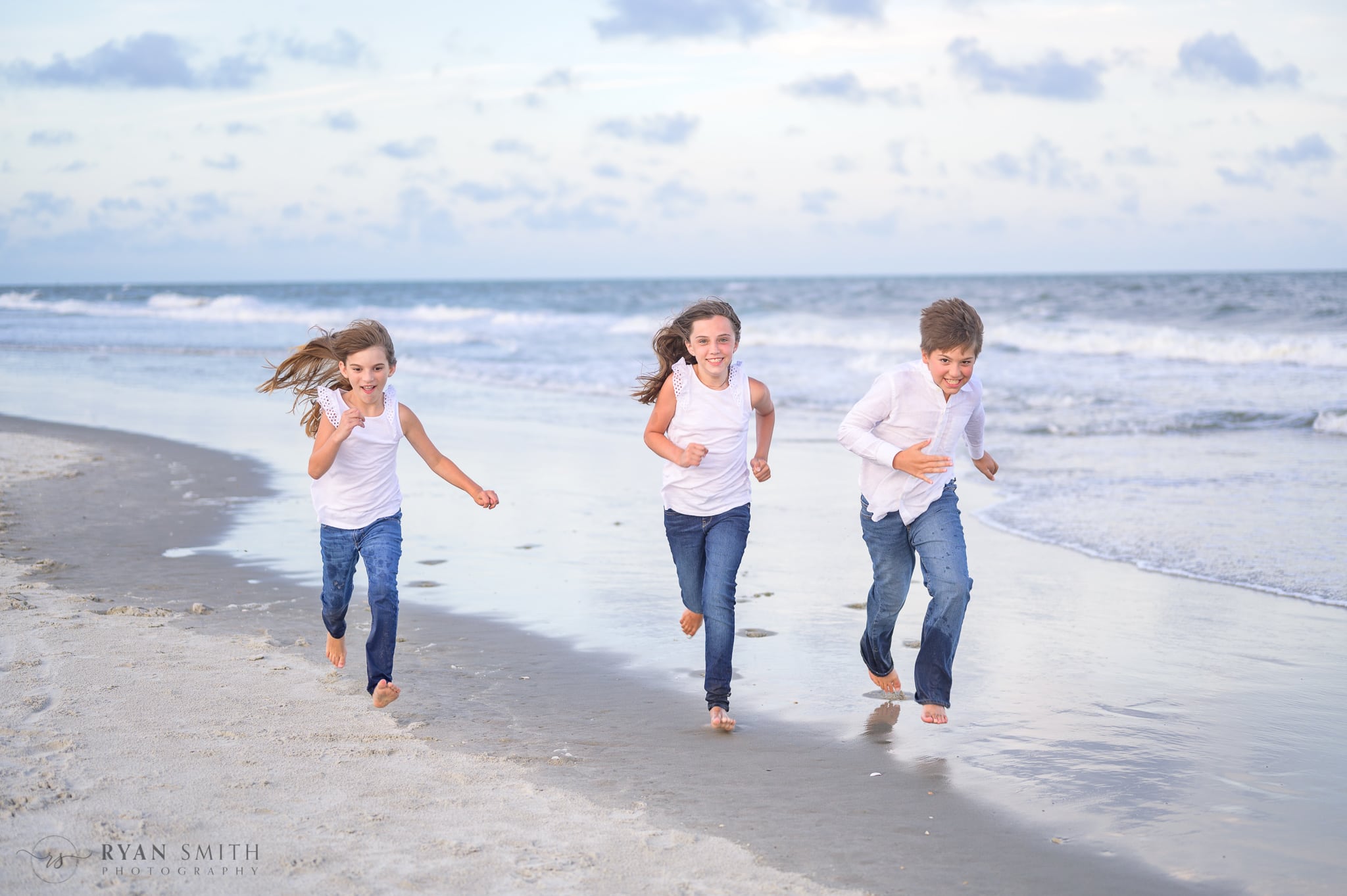 Kids running down the beach - Huntington Beach State Park