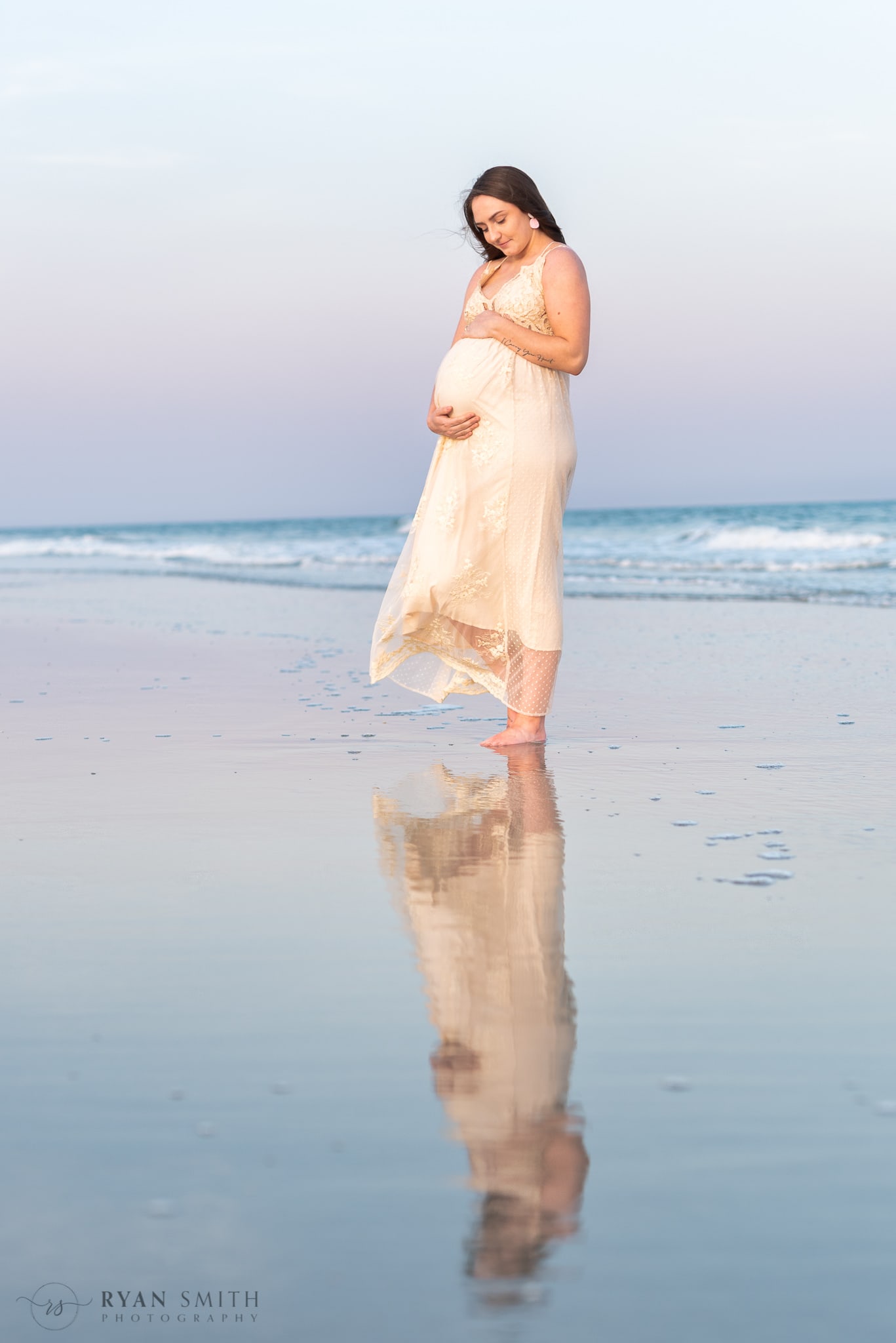 Maternity portrait reflecting in the water - Huntington Beach State Park
