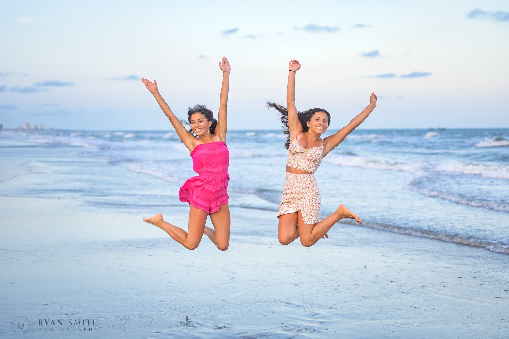 Sisters jumping in the air - North Myrtle Beach