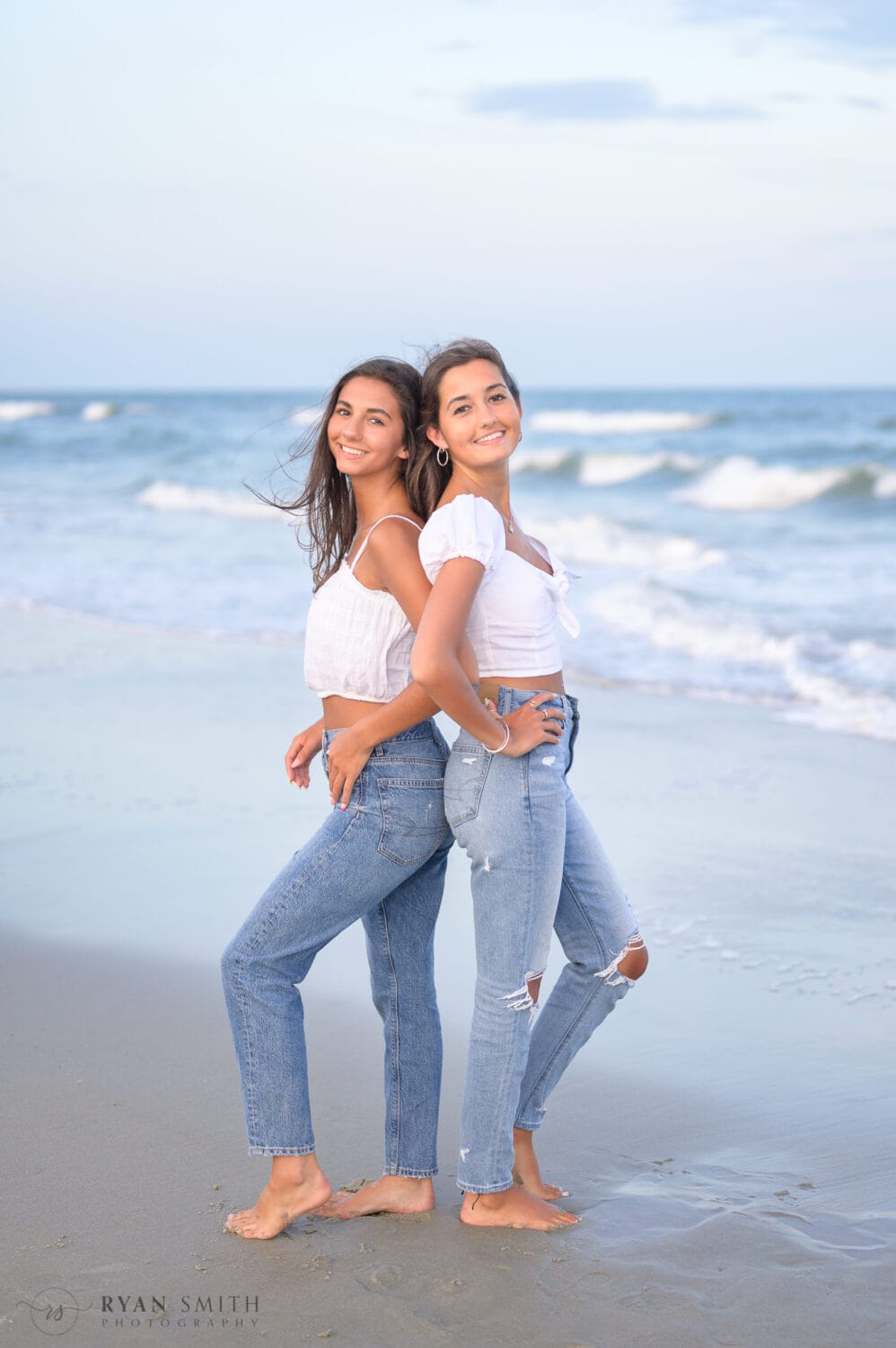 Sisters posing by the ocean - Huntington Beach State Park