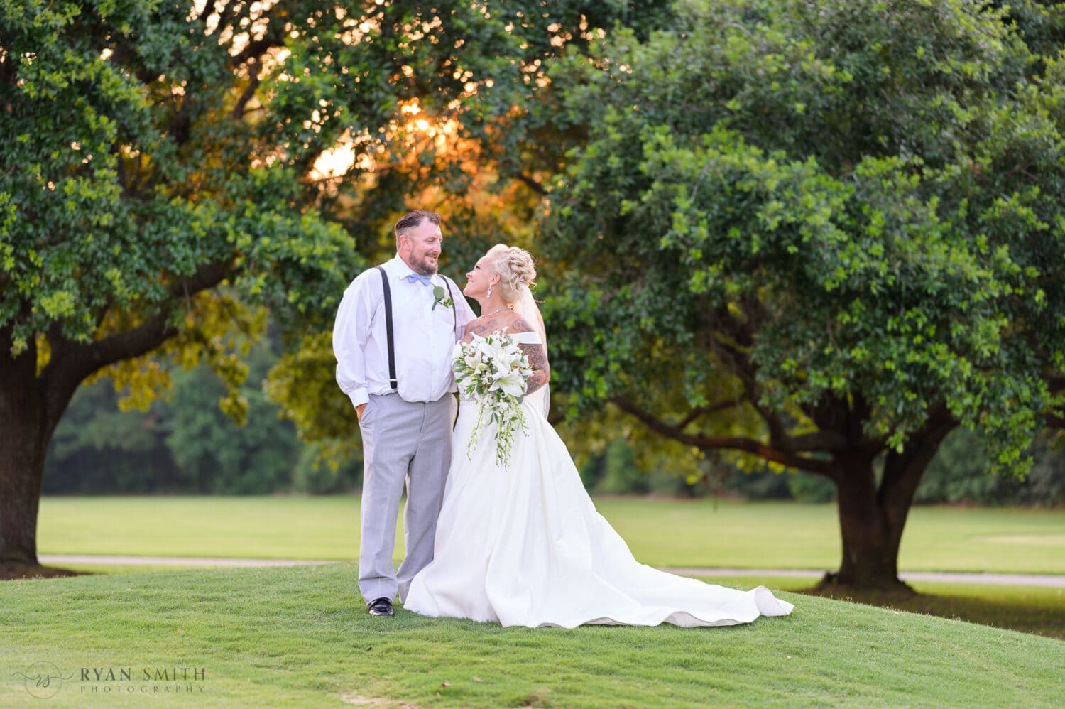 Bride and groom under the oaks - Wild Wing Plantation