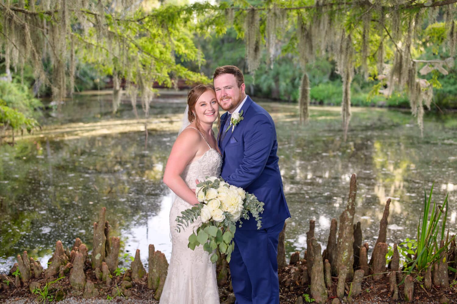 Bride and groom with huge smiles  - Magnolia Plantation