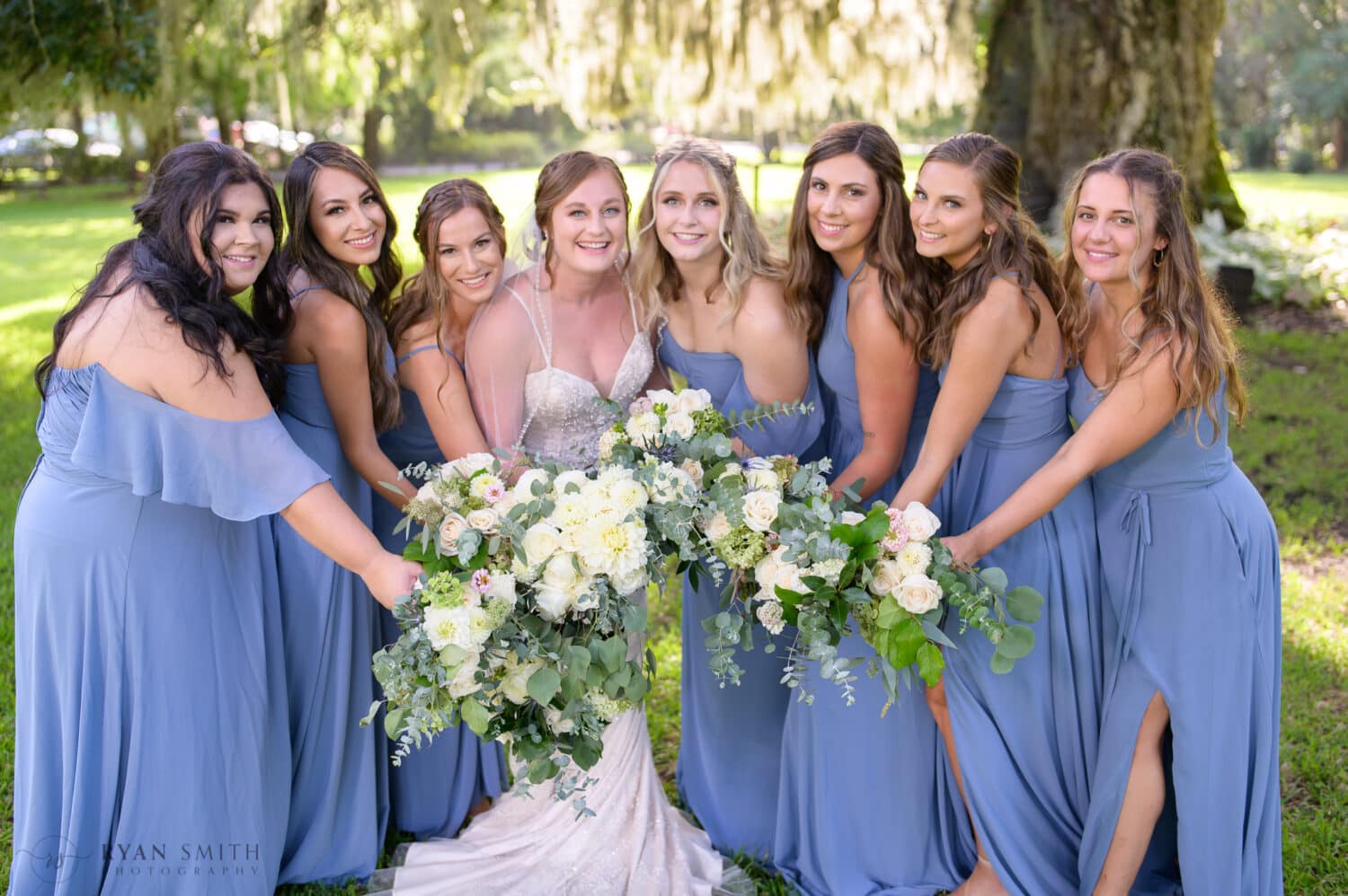 Bridesmaids holding the flowers together - Magnolia Plantation