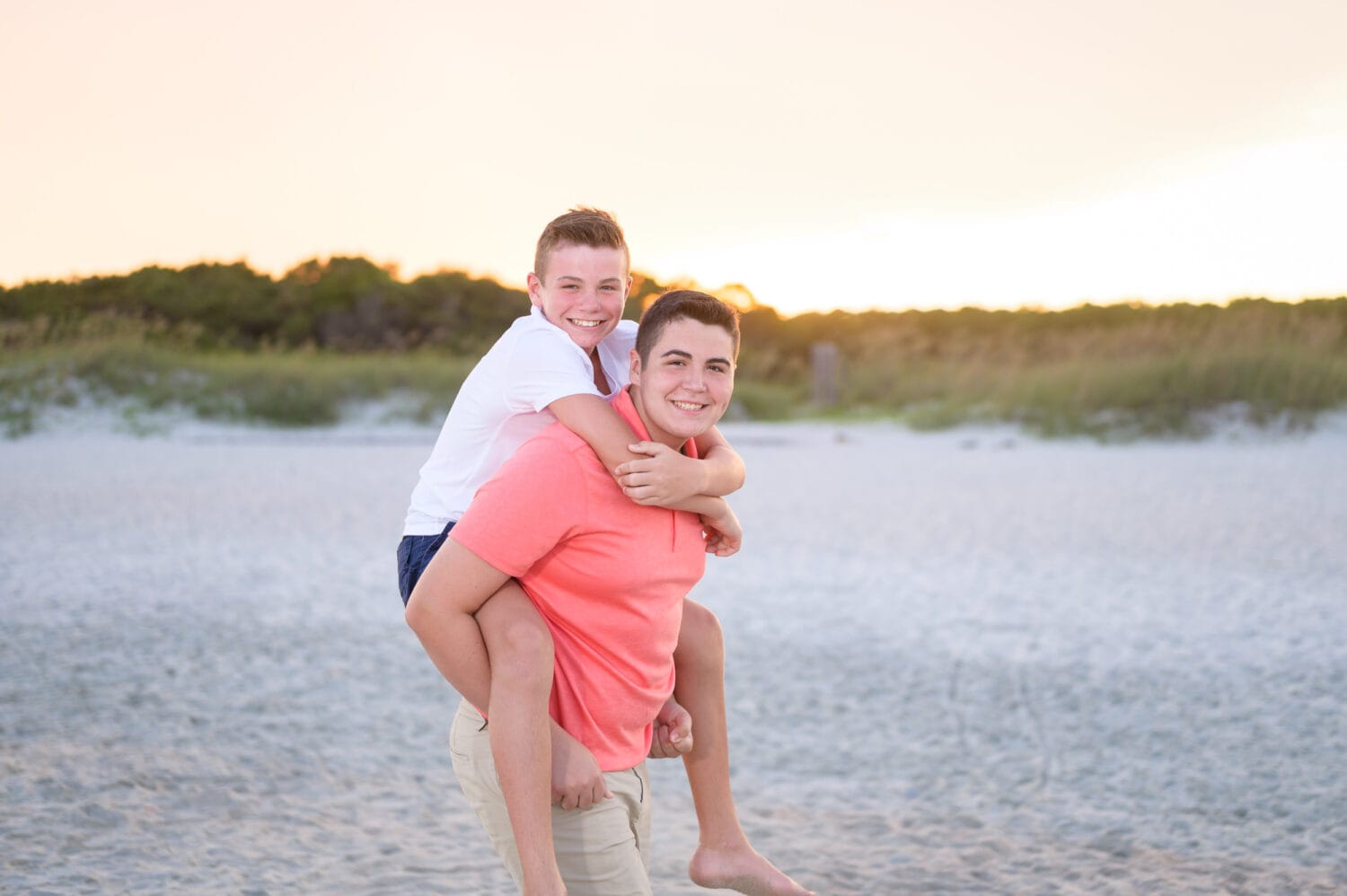 Brother giving a piggyback ride - Huntington Beach State Park