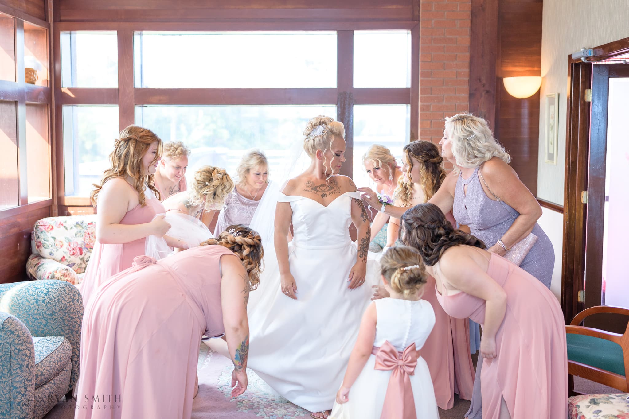Helping bride into her dress - Wild Wing Plantation