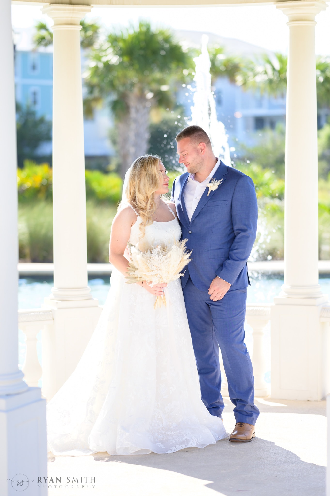 Bride and groom under the gazebo  - North Beach Resort & Villas
