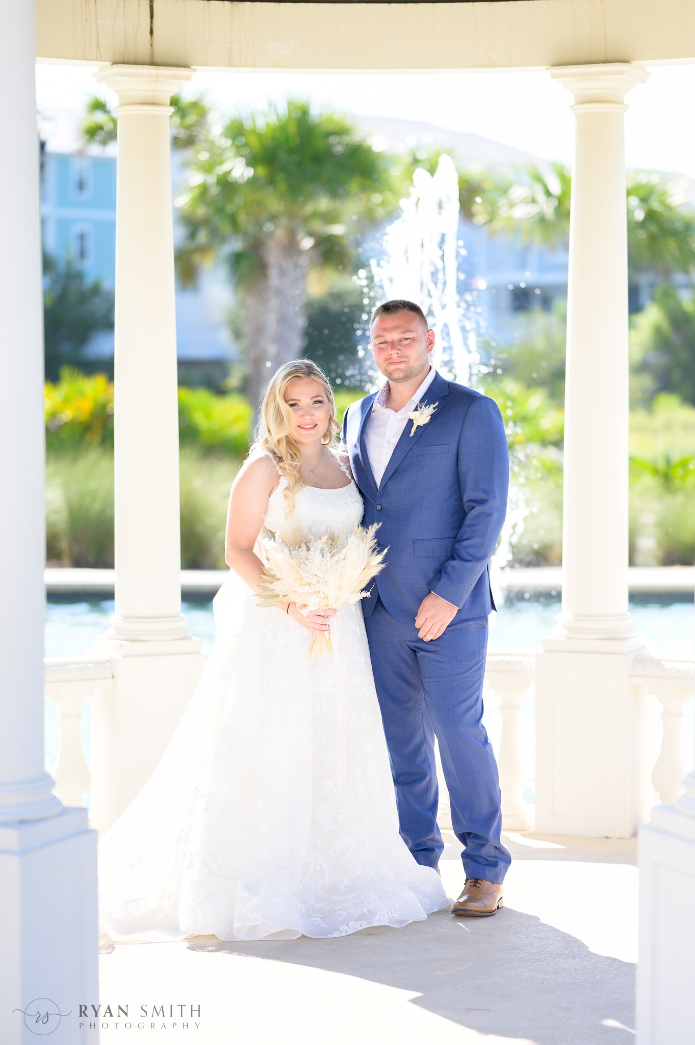 Bride and groom under the gazebo  - North Beach Resort & Villas