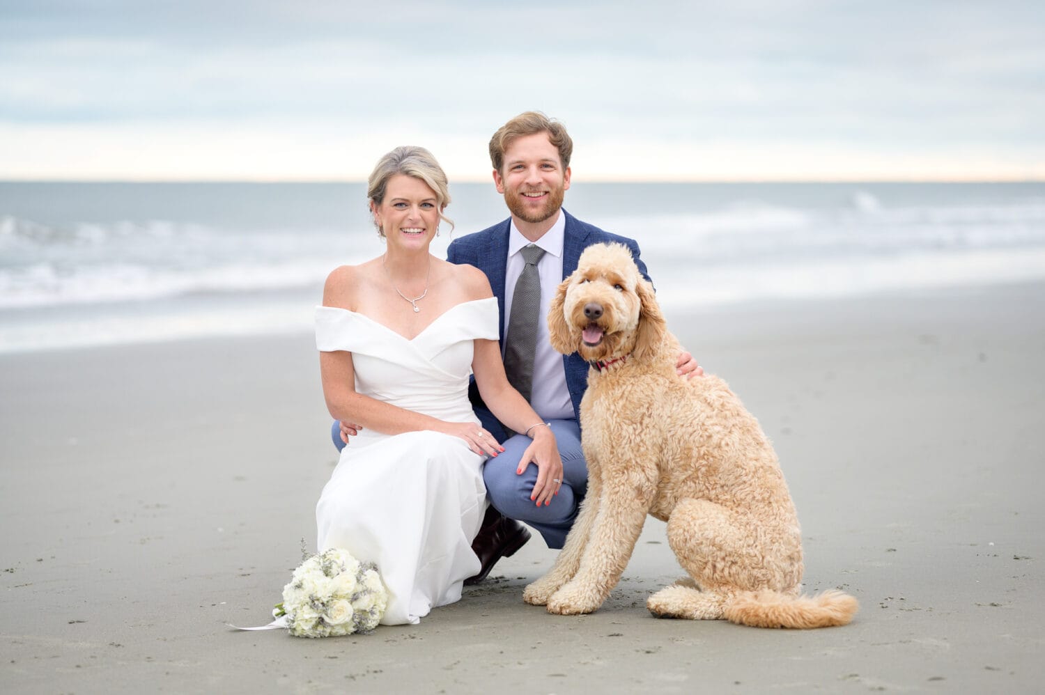 Goldendoodle with mom and dad after wedding - Pawleys Island