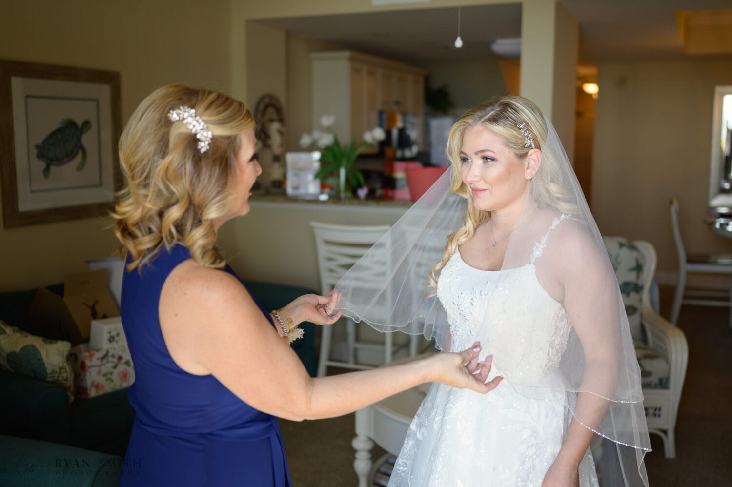 Mom helping bride with her veil - North Beach Resort & Villas