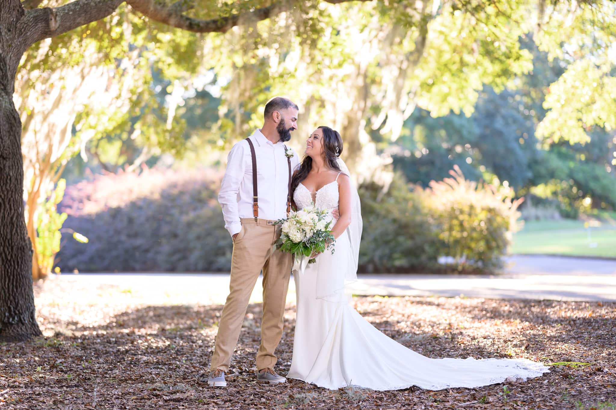 Bride and groom in front of the clubhouse - Pawleys Plantation