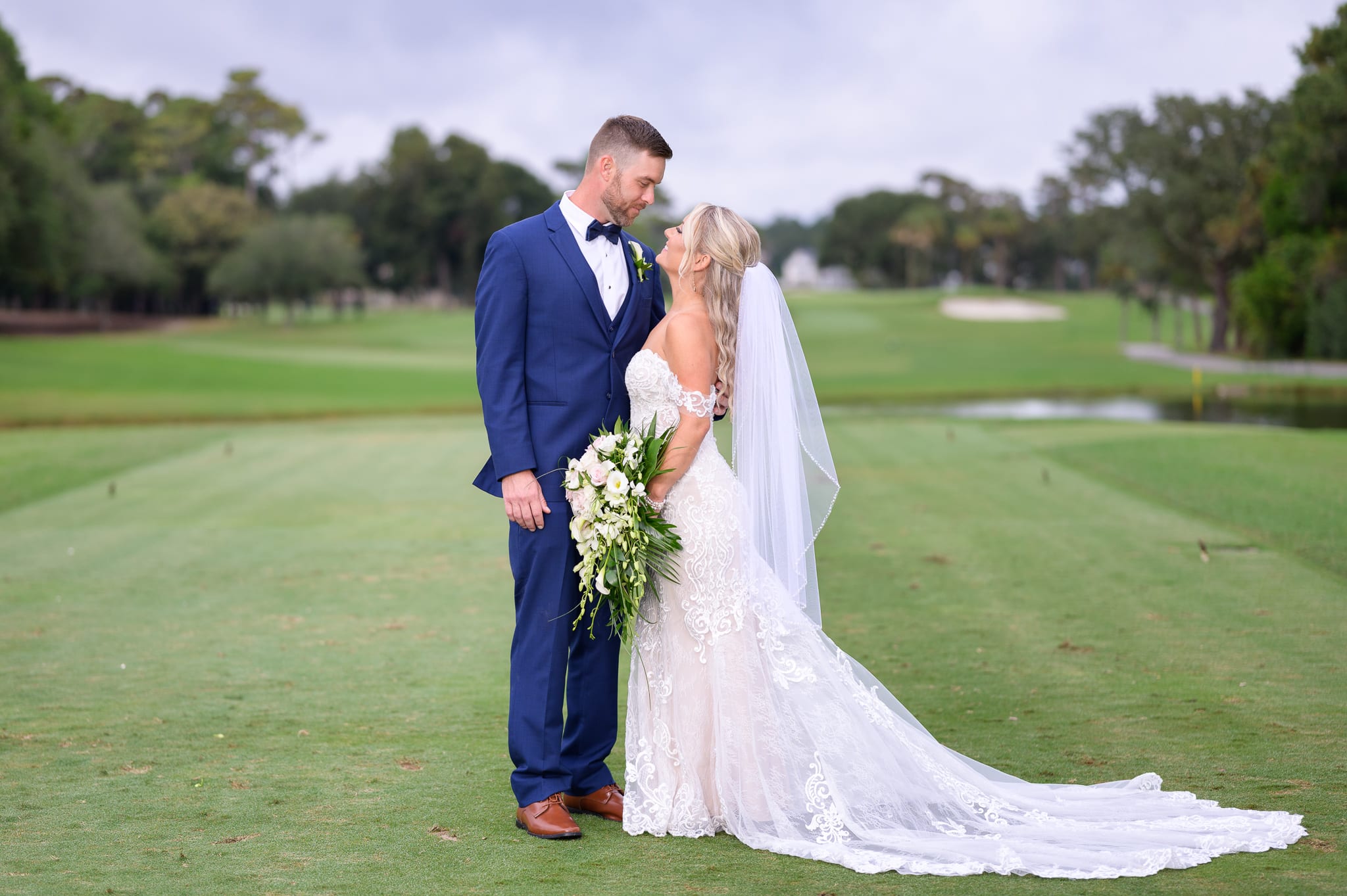 Bride and groom on the golf course - Dunes Golf and Beach Club
