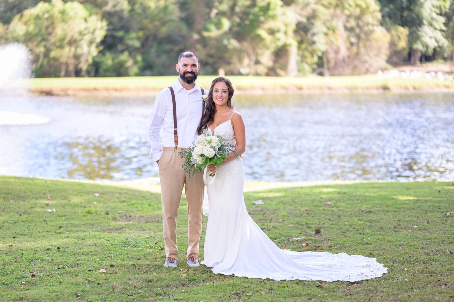Bride and groom portraits by the lake before the ceremony - Pawleys Plantation