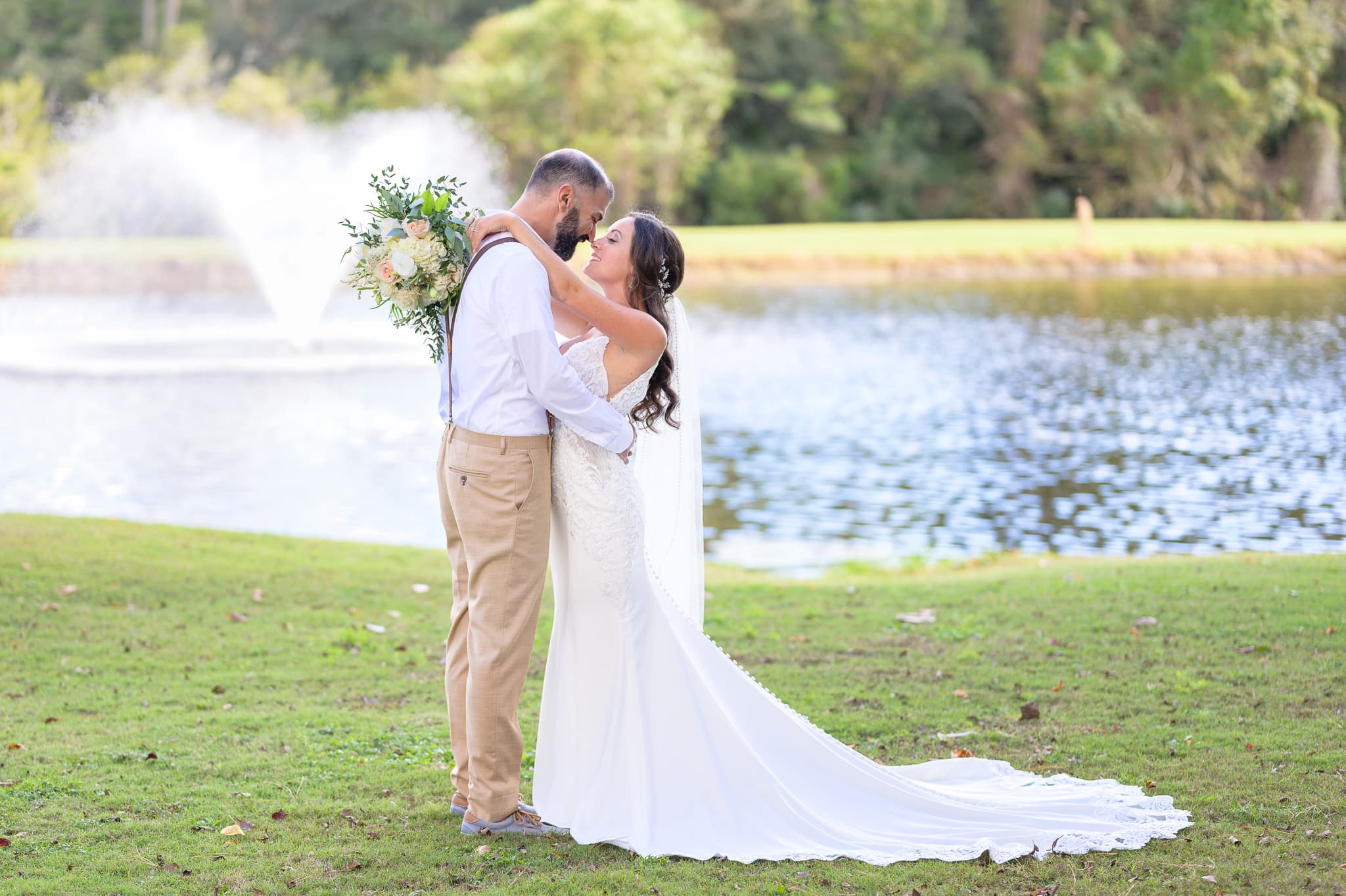 Bride and groom portraits by the lake before the ceremony - Pawleys Plantation
