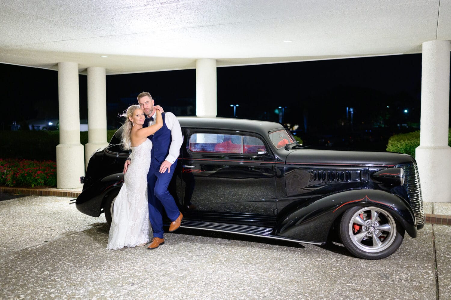 Bride and groom with classic car at night - Dunes Golf and Beach Club
