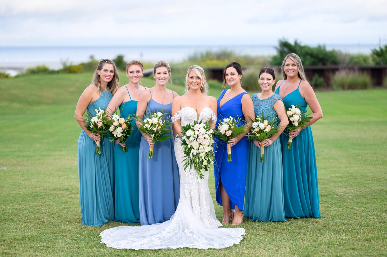 Bride with bridesmaids by the ocean - Dunes Golf and Beach Club