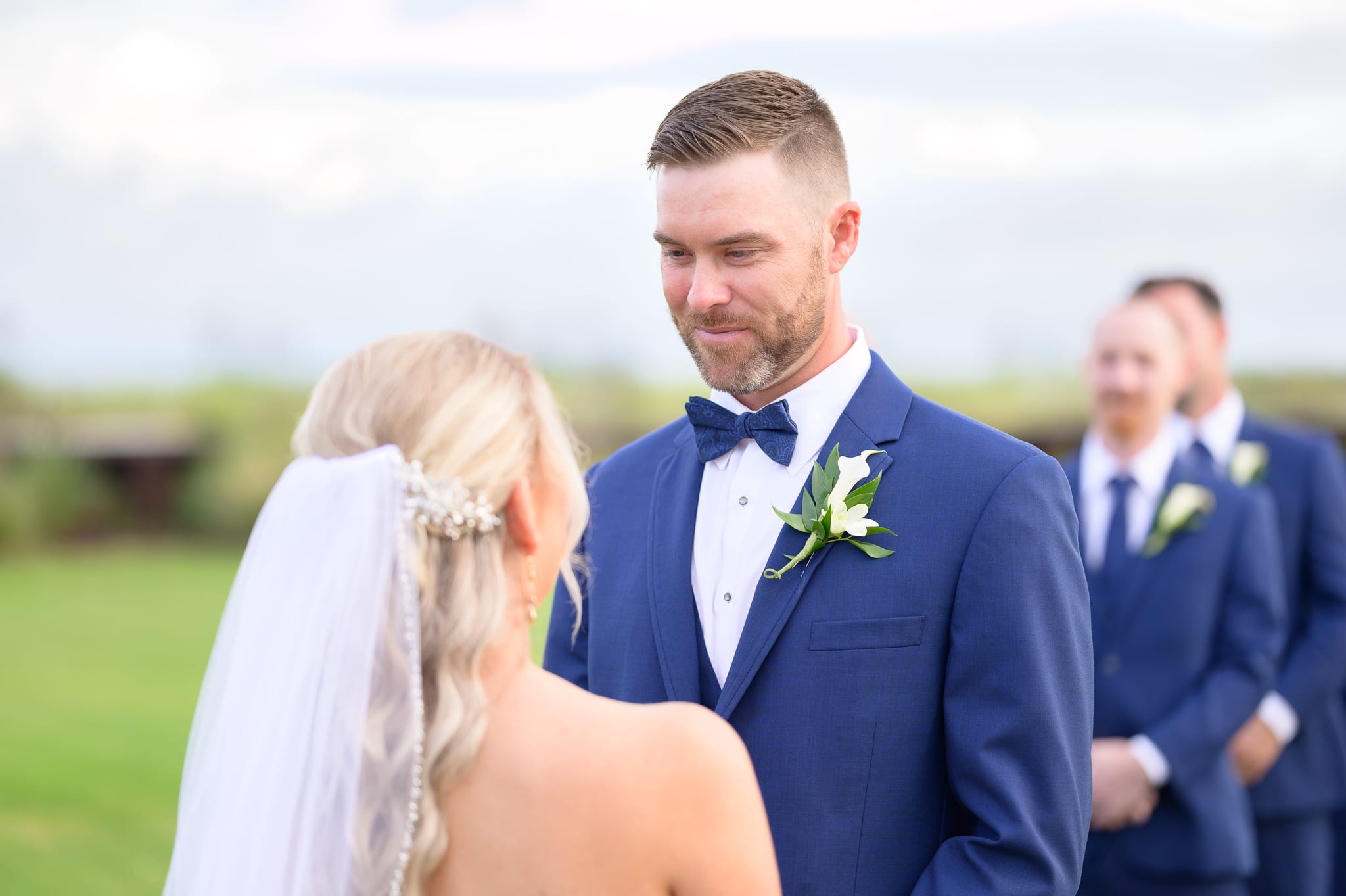 Groom looking at bride during the vows - Dunes Golf and Beach Club