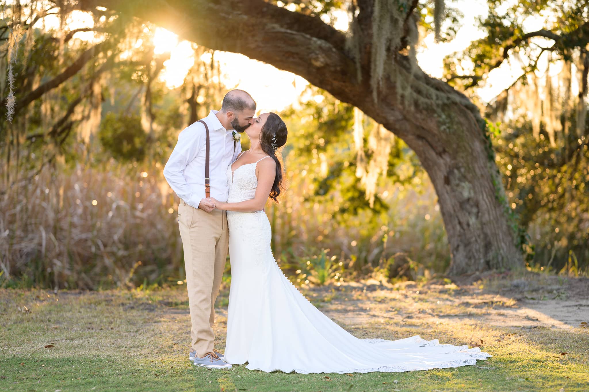 Kiss with sunlight filtering through the tree - Pawleys Plantation
