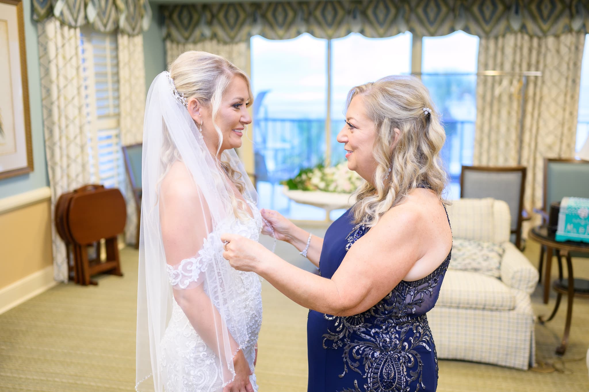 Mom helping bride with veil - Dunes Golf and Beach Club