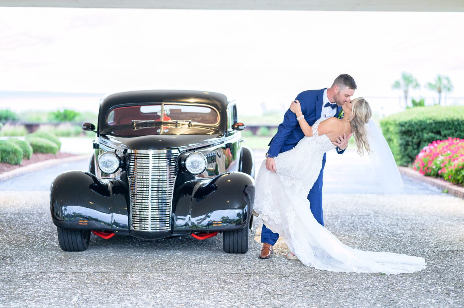 Pictures with the groom's father's classic car - Dunes Golf and Beach Club