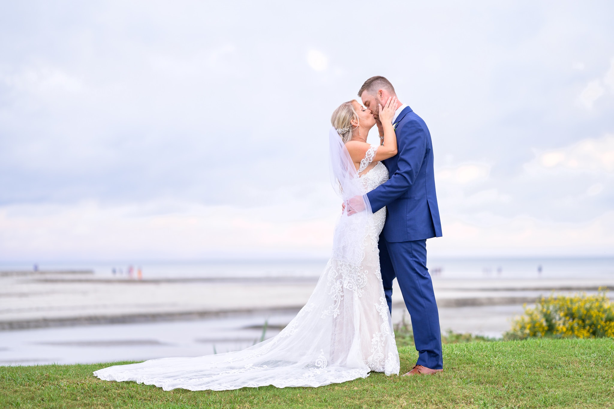 Portraits of bride and groom on the hill overlooking the ocean - Dunes Golf and Beach Club