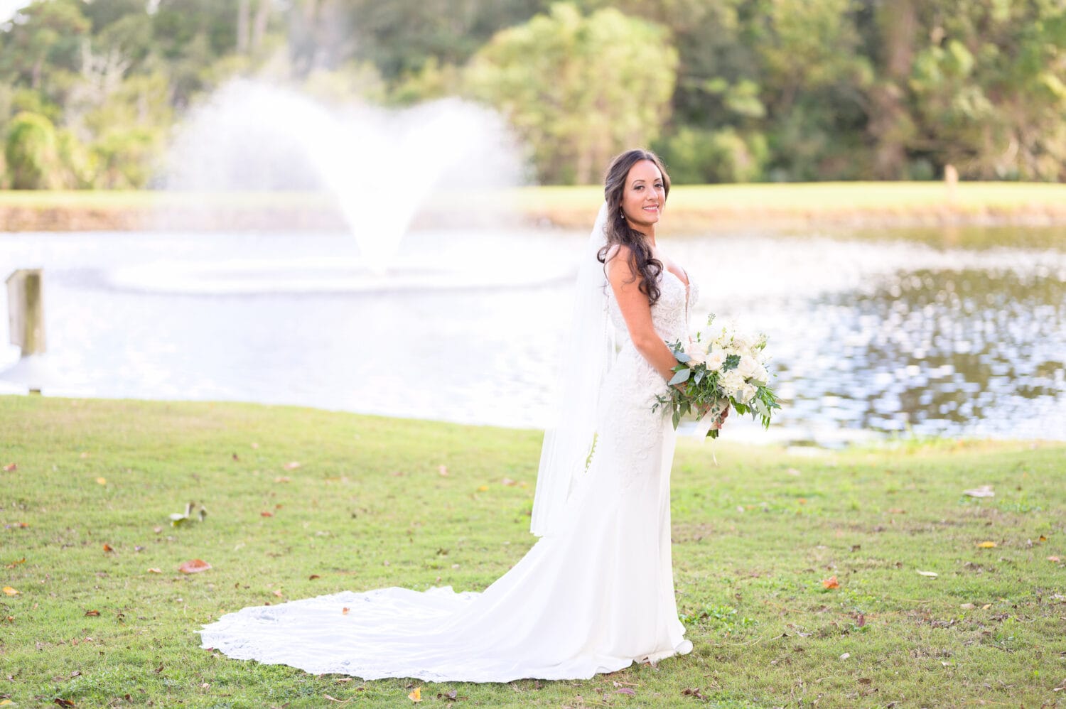 Portraits of bride before the ceremony by the lake - Pawleys Plantation