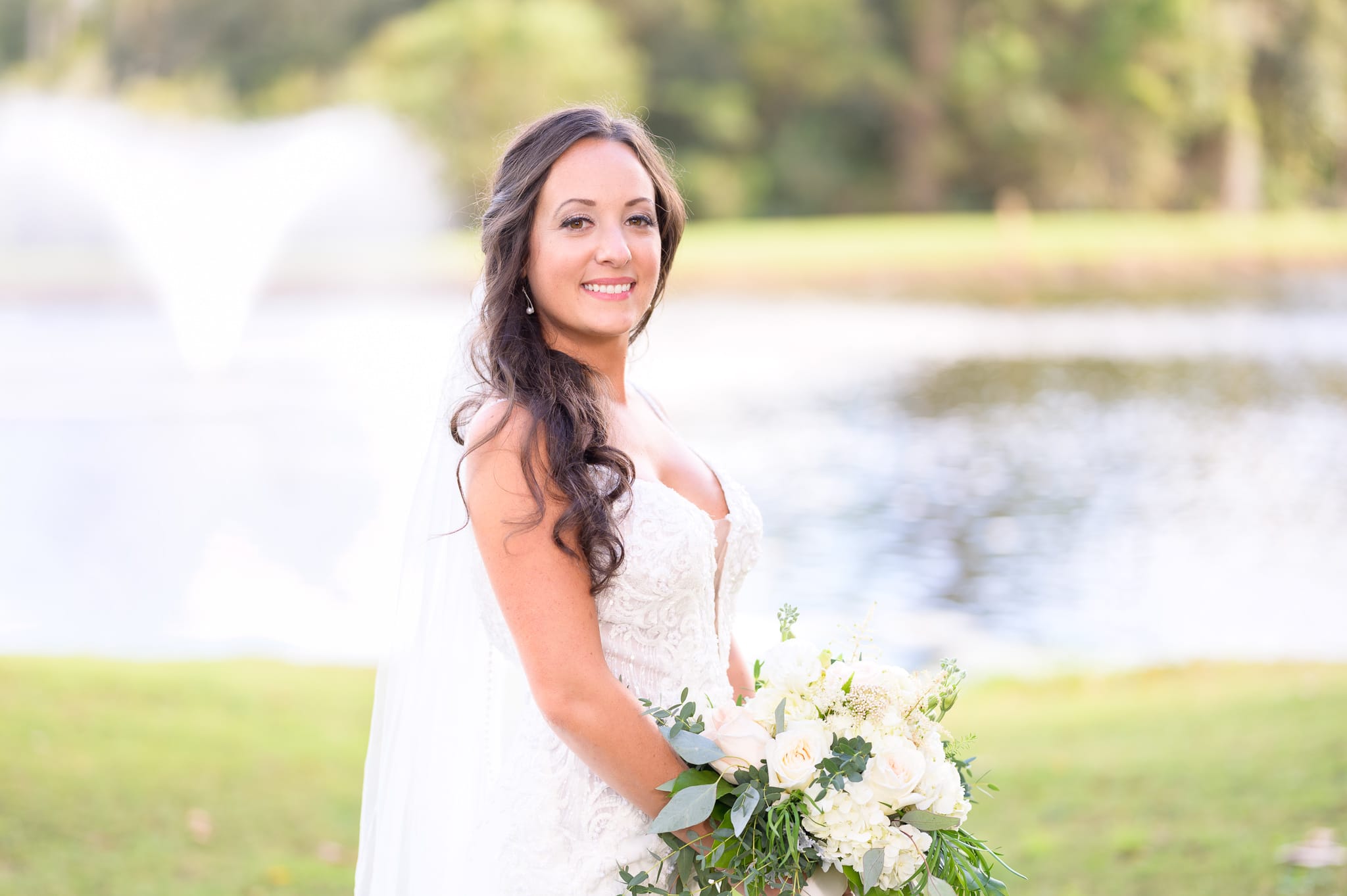 Portraits of bride before the ceremony by the lake - Pawleys Plantation