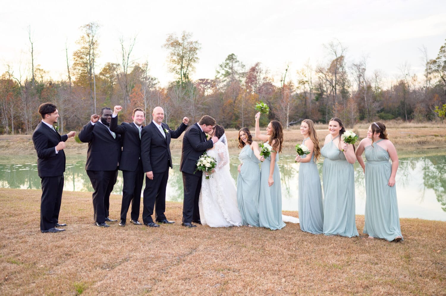 Bridal party cheering from bride and groom - The Venue at White Oaks Farm