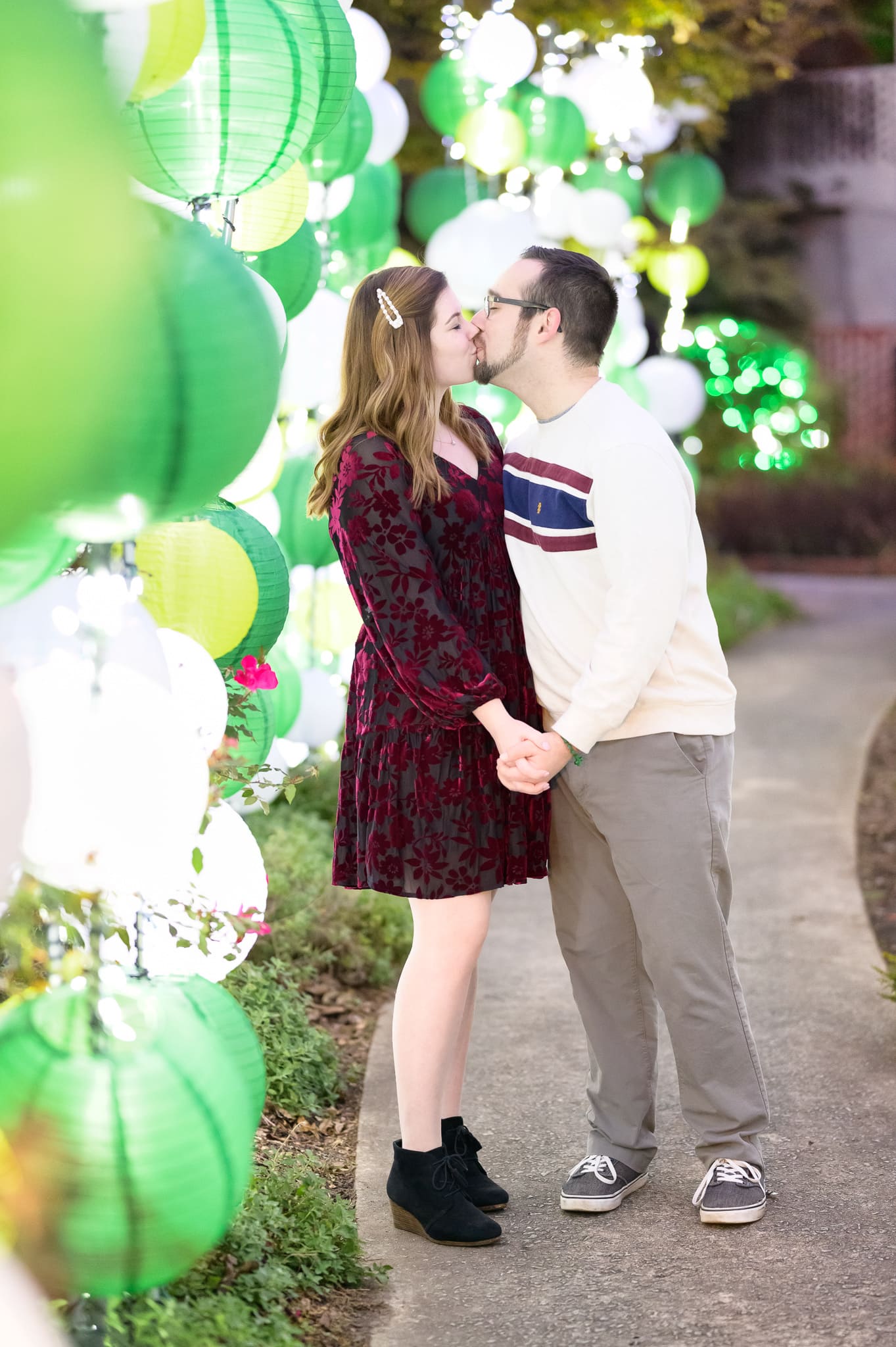 Cute engagement portraits with the colorful lanterns during the Night of a Thousand Candles - Brookgreen Gardens