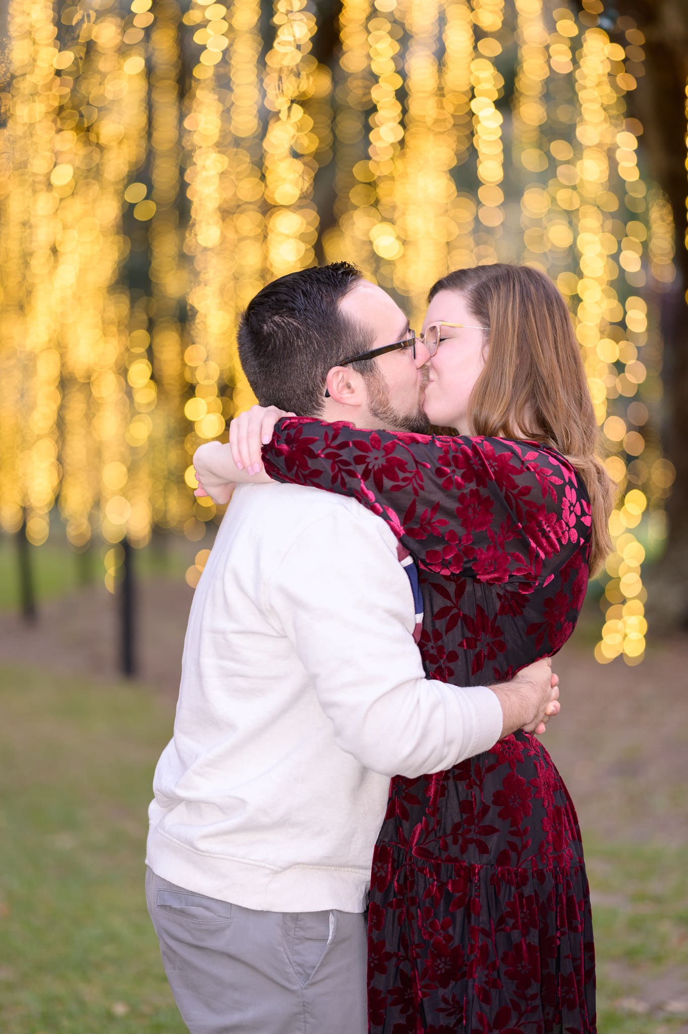 Engagement portraits with lights hanging from the trees on the Live Oak Allee - Brookgreen Gardens