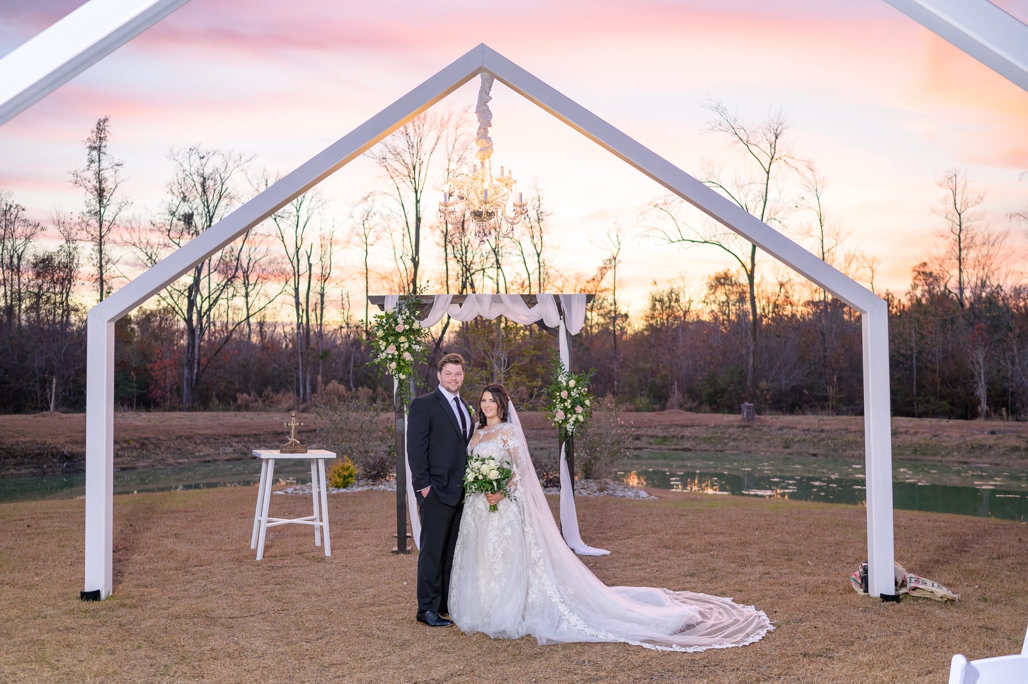 Sunset under the outdoor chandelier   - The Venue at White Oaks Farm