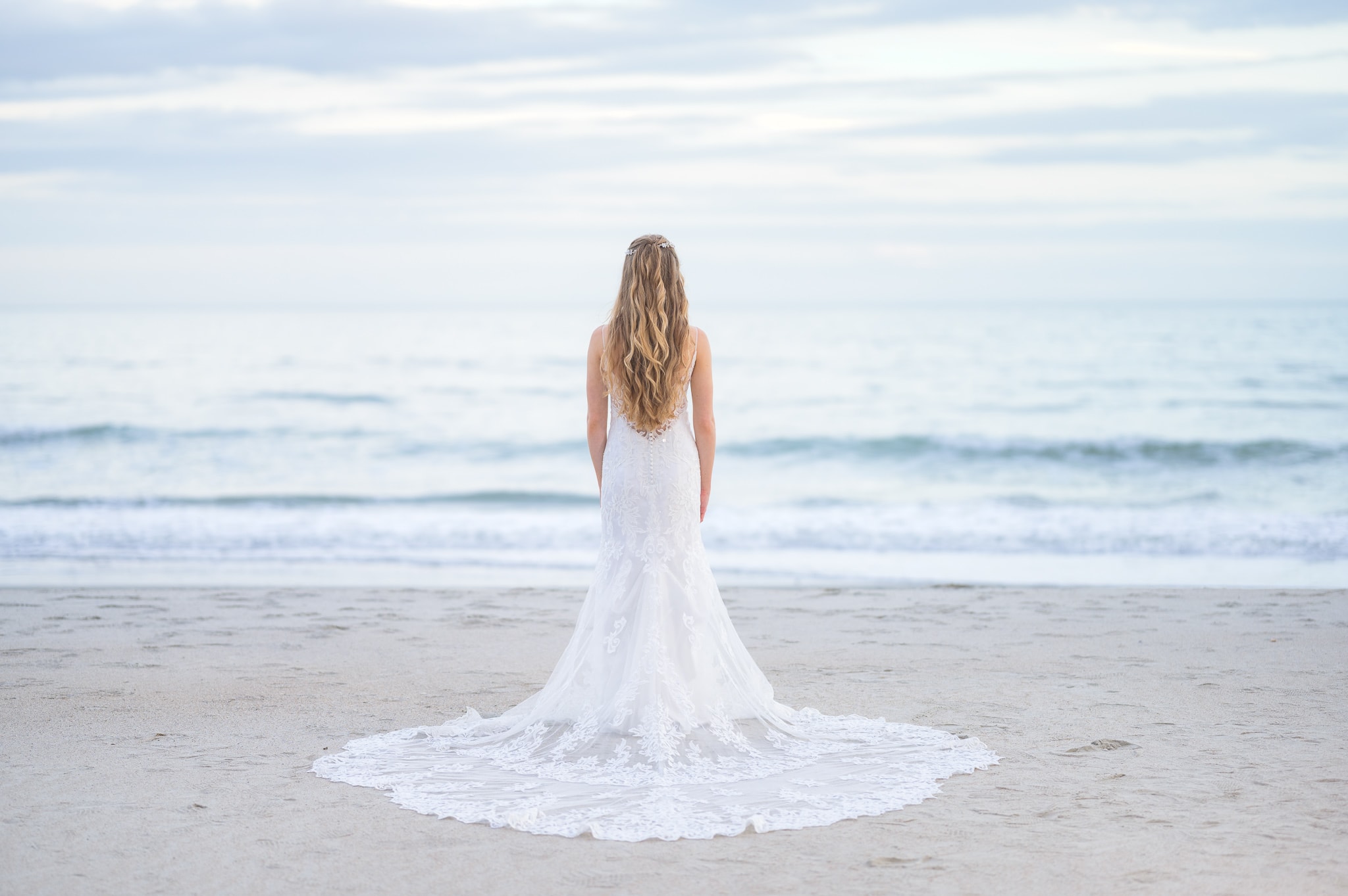 Bride looking out at the ocean -