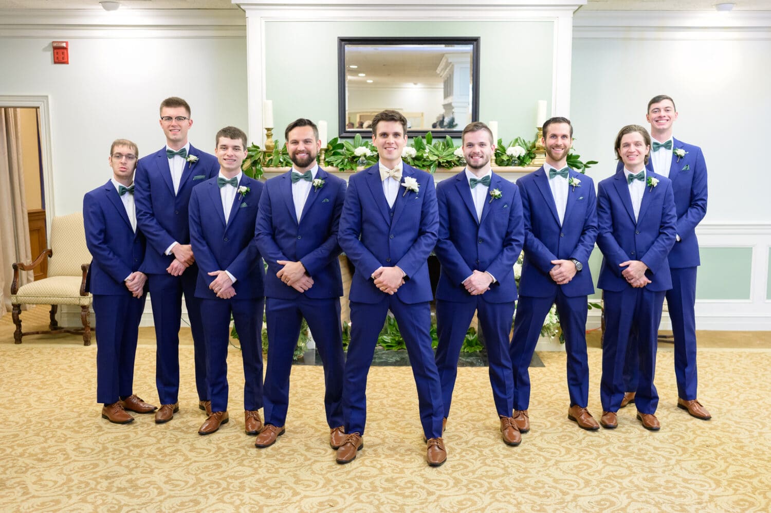 Groomsmen in front of the fireplace  - Pawleys Plantation Golf & Country Club
