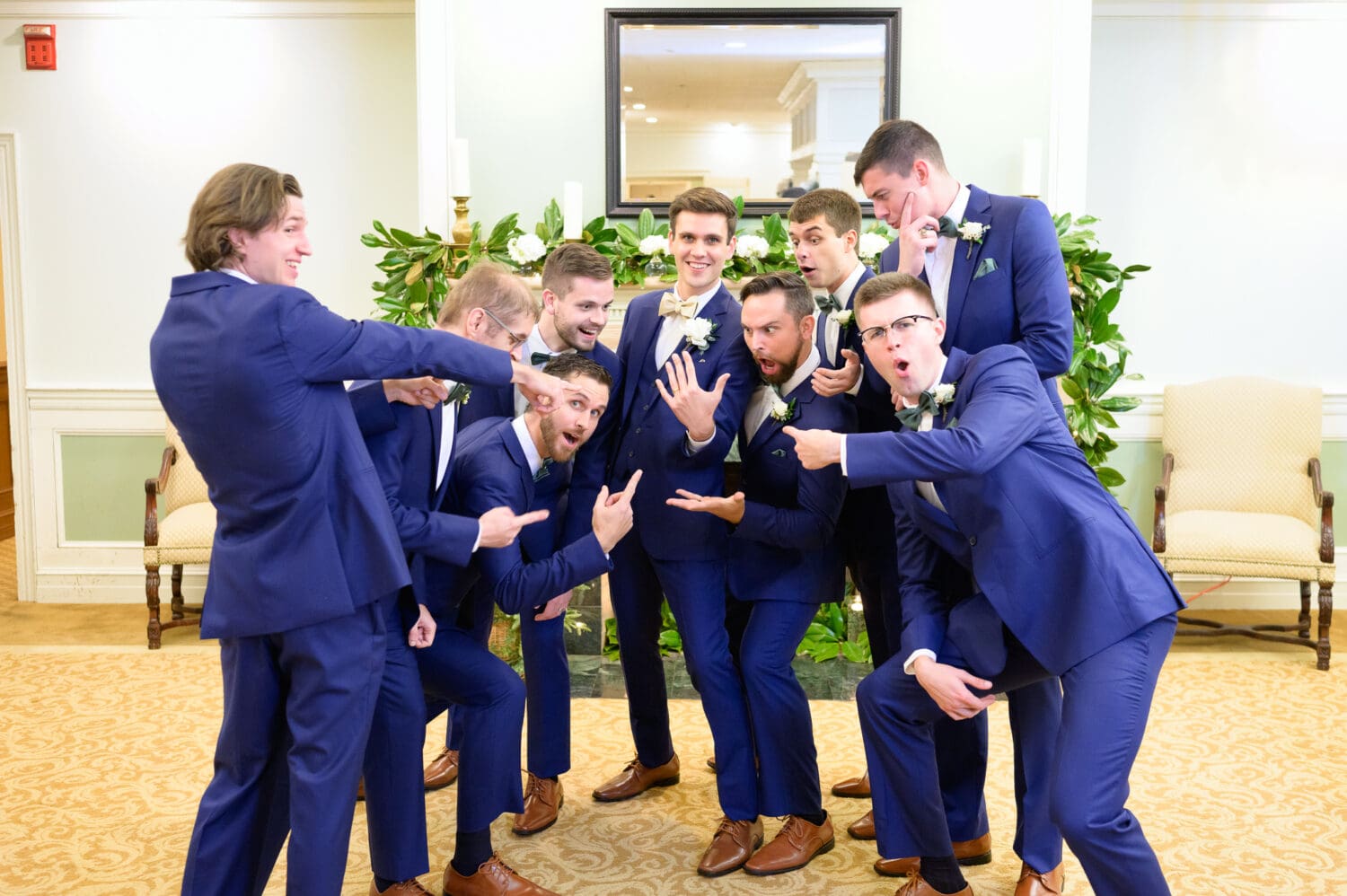 Groomsmen pointing at the groom's ring - Pawleys Plantation Golf & Country Club
