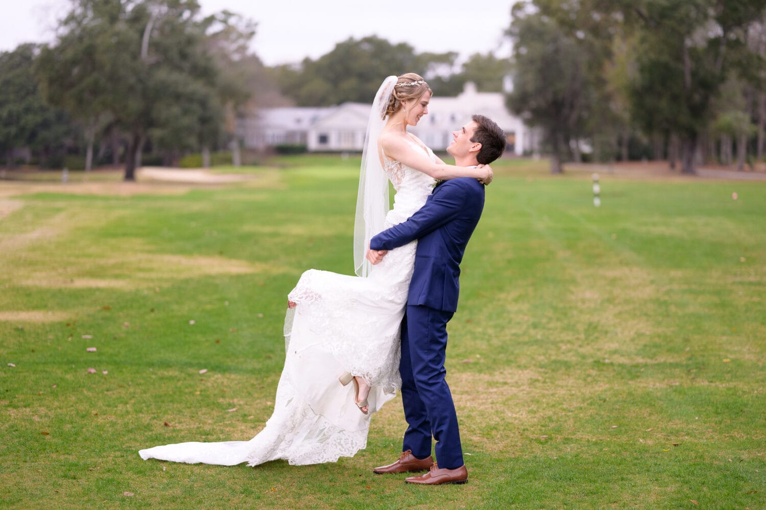 Lifting bride on the golf course - Pawleys Plantation Golf & Country Club