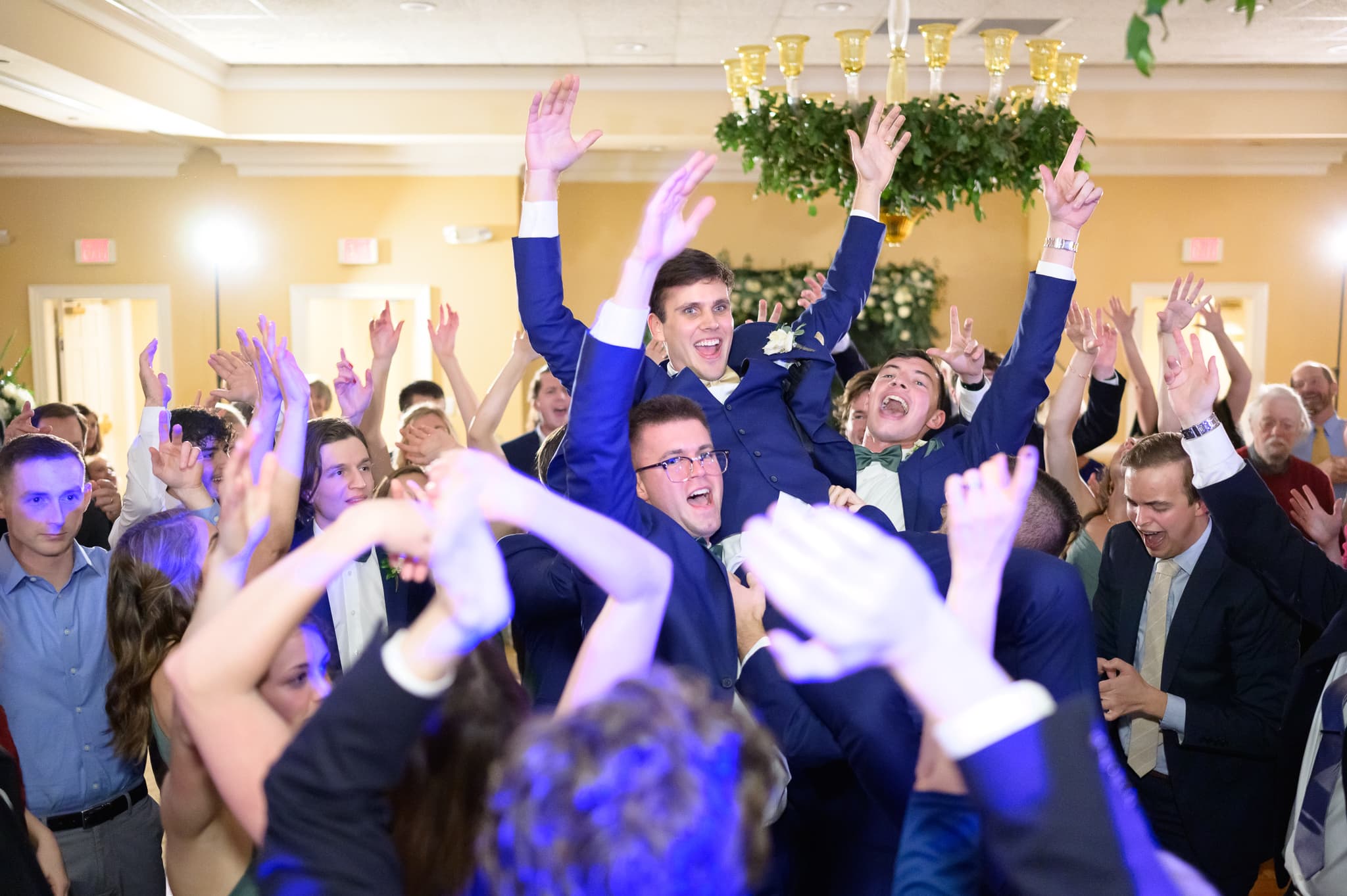 Lifting groom into the air on the dance floor - Pawleys Plantation Golf & Country Club