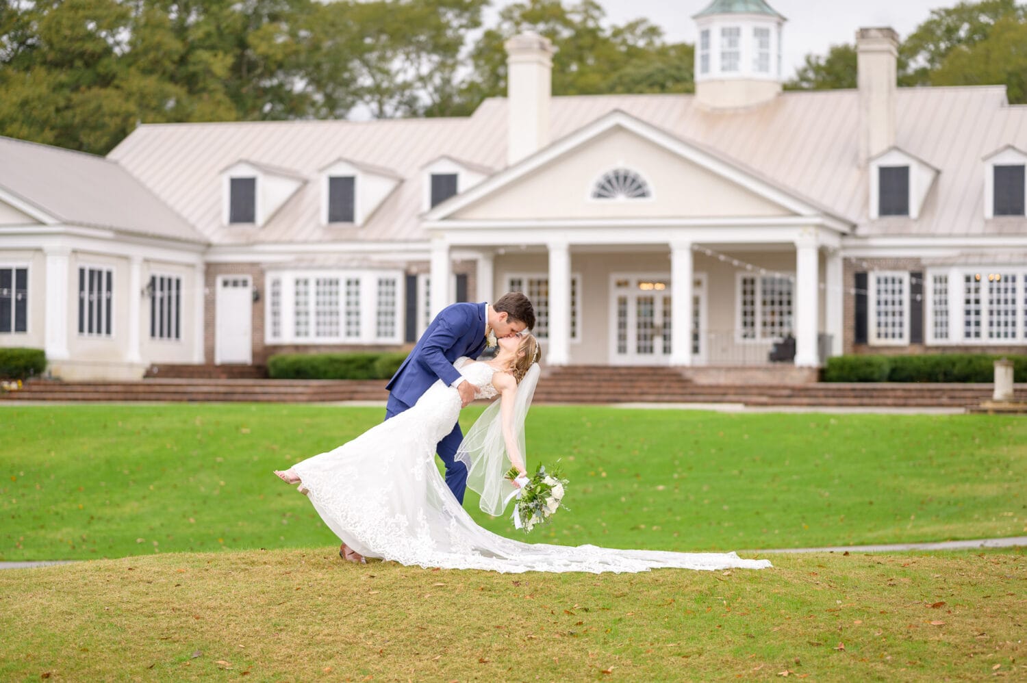 Portraits of bride and groom on the hill behind the clubhouse - Pawleys Plantation Golf & Country Club