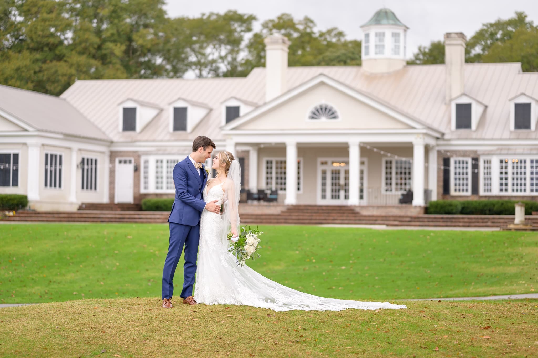 Portraits of bride and groom on the hill behind the clubhouse - Pawleys Plantation Golf & Country Club