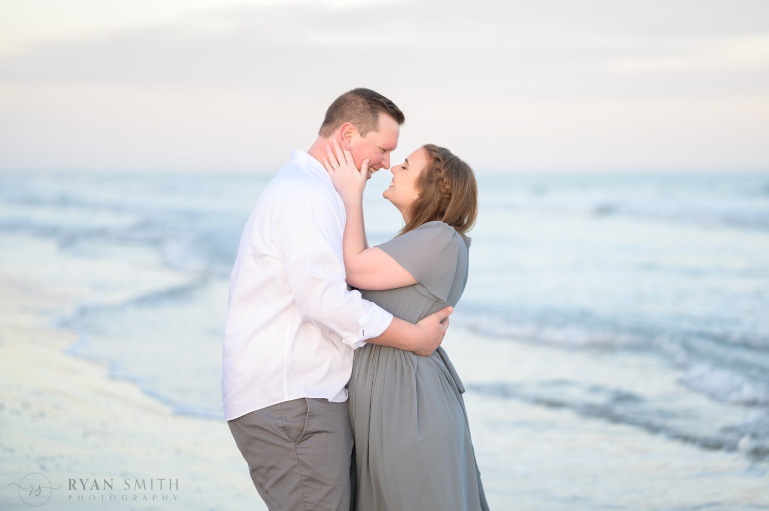 Happy couple touching noses by the ocean - Huntington Beach State Park - Myrtle Beach