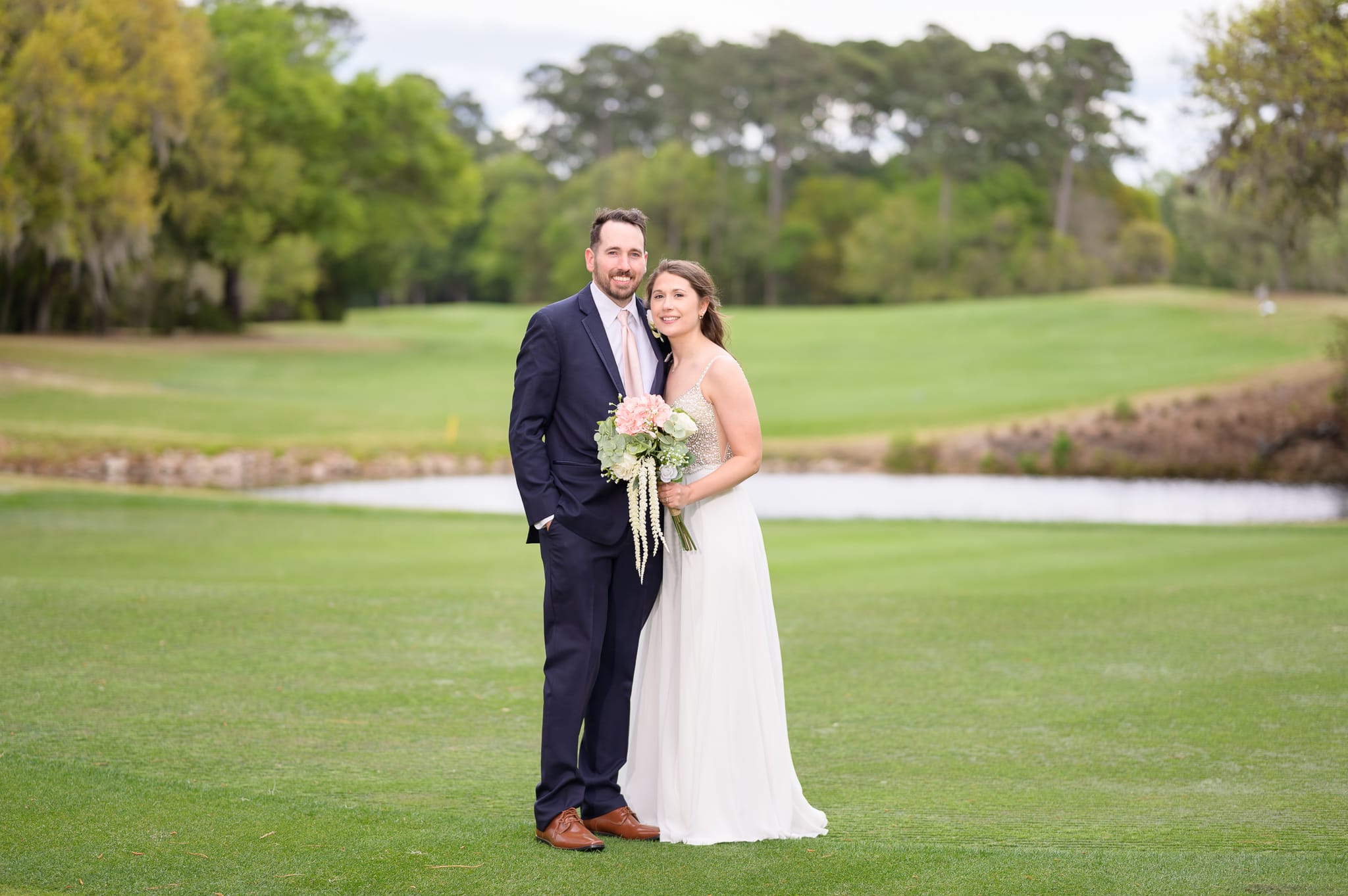 Bride and groom on the golf course - Caledonia Golf & Fish Club