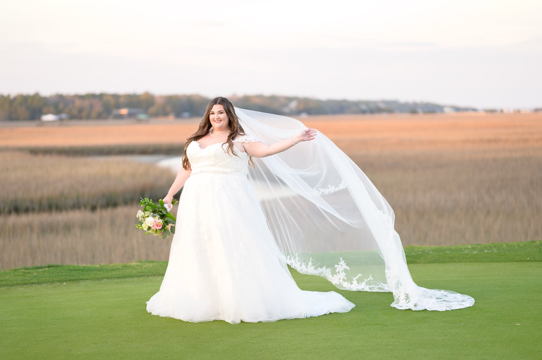 Bride holding her veil in the air - Pawleys Plantation Golf & Country Club
